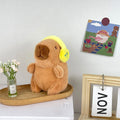 Capivara fofa com fone de ouvido em pelúcia