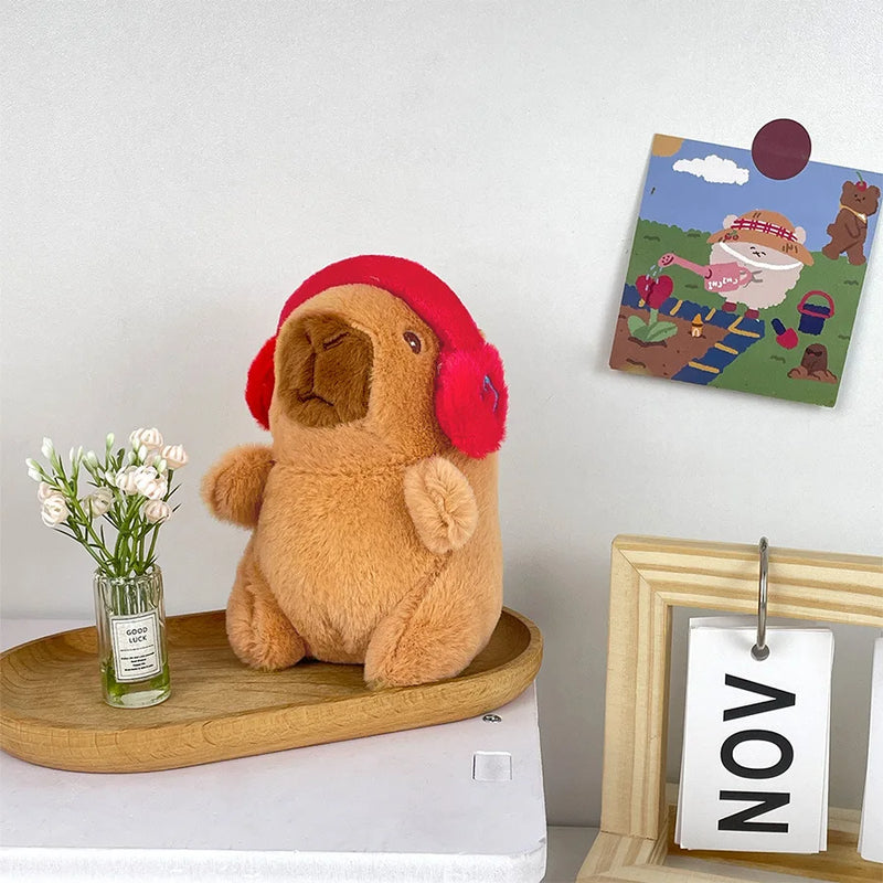 Capivara fofa com fone de ouvido em pelúcia